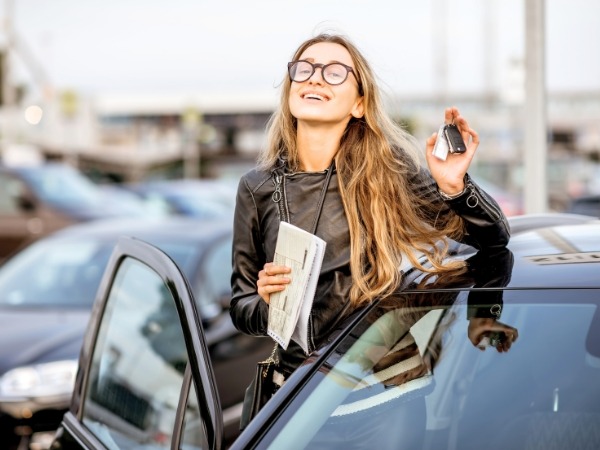 Woman Entering a Black Car