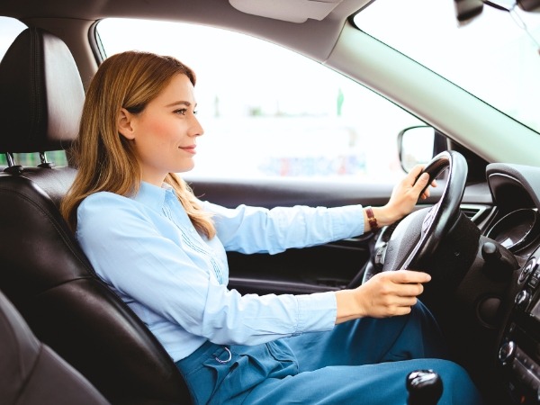 Woman Driving a Car