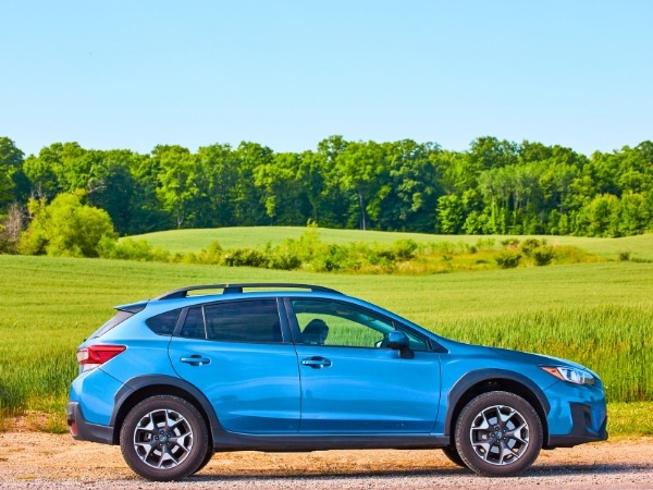 Blue Car on a Rural Road