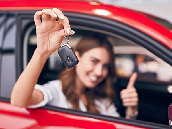 Woman Holding a Car Key