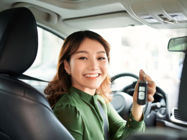 Woman Holding a Car Key