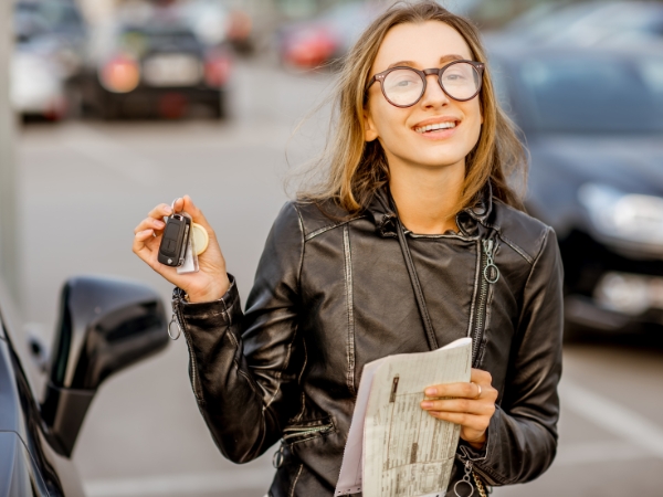 Woman with a Rental Car