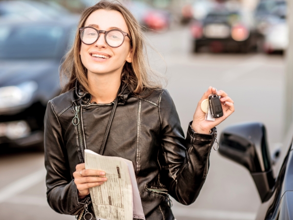 Woman with a Rental Car