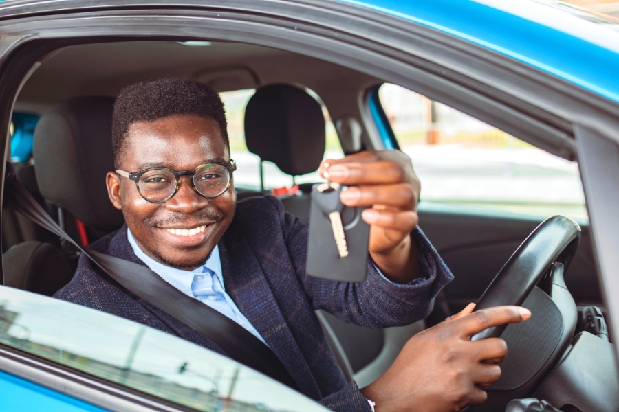 Man Driving a Blue Car